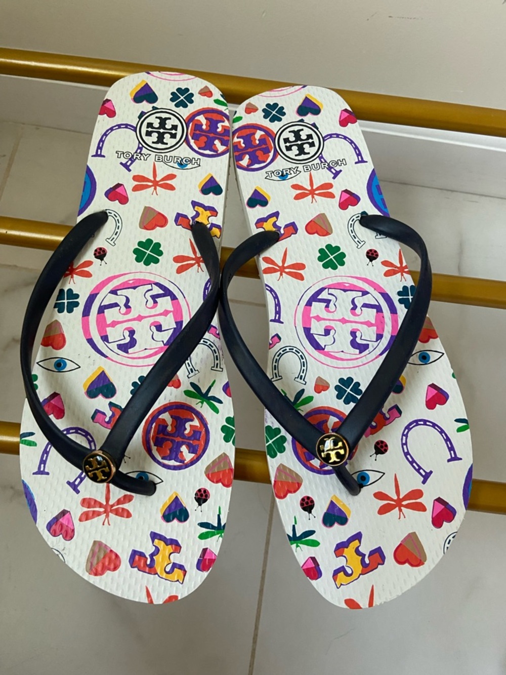 Tory Burch White Multicolor Logo & Icon Flip Flops with Black Straps 11